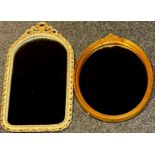 A white painted and gilt arched rectangular mirror, 73cm x 38cm; a gilt oval mirror (2)