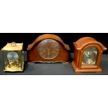 A mahogany eight day mantel clock, Westminster chime, Roman numerals, three winding holes, key; a