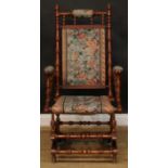 A late 19th century American design spring rocking chair, ring-turned throughout, 124cm high, 63cm