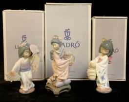 A Lladro Geisha figure, Michico, number 01447, boxed; two others, Oriental Dance, number 06230 and