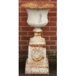 A 19th century cast iron campana shaped garden urn and plinth, egg-and-dart rim, the plinth cast and
