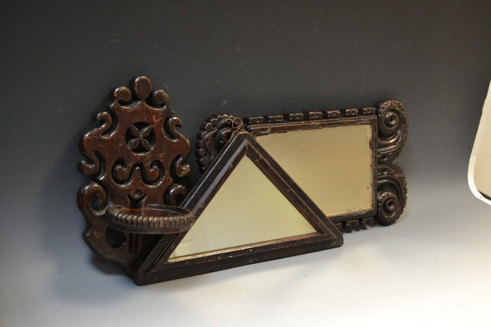 A 19th century oak rectangular mirror, carved frame, 43cm x 20cm; an oak wall bracket, pierced and