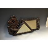 A 19th century oak rectangular mirror, carved frame, 43cm x 20cm; an oak wall bracket, pierced and