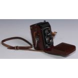 Photography - a Rolleiflex twin lens camera, Synchro Compur, serial number 1421042, leather case