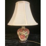 A Moorcroft magnolia pattern ovoid table lamp lamp