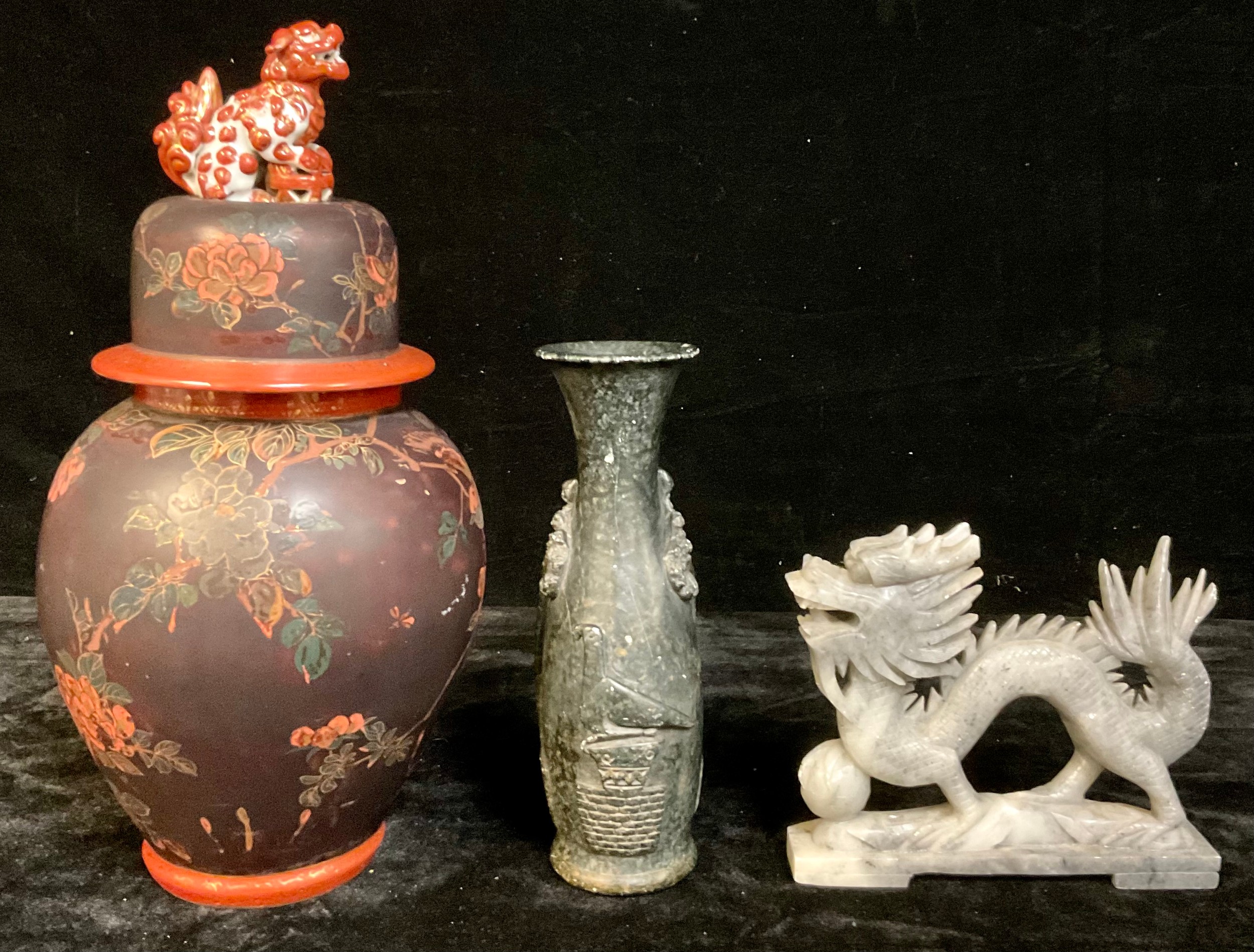 An Chinese temple jar, temple dog finial; a soapstone carving of a dragon and the flaming pearl; a