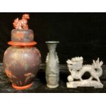 An Chinese temple jar, temple dog finial; a soapstone carving of a dragon and the flaming pearl; a