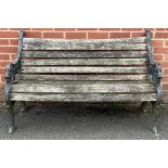 A cast iron and hardwood garden bench, 81cm high, 128cm wide, the seat 120cm wide and 39cm deep
