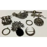 A collection of seven silver and marcasite brooches; two marcasite pendants (9)