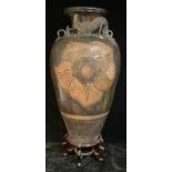 A Chinese terracotta floor standing two-handled amphora vase, moulded in relief with a dragon, 97cm,
