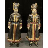 A pair of Russian cold painted 'bronze' metal figures as Cossacks, each approximately 40cm high (2)
