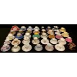 A collection of decorative coffee cups and saucers, including Royal Worcester, Coalport, Gray's
