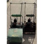 A pair of Atco petrol roller lawnmowers