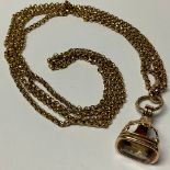 A late 19th century 9ct gold guard chain, suspended with a 9ct rose gold and smokey quartz seal fob,