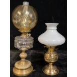 A late 19th/early 20th century Duplex oil lamp, clear glass font, knopped brass column and