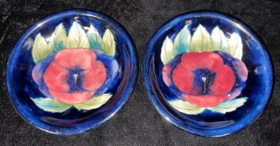 A pair of Moorcroft Pansy pattern dishes, 19cm diameter