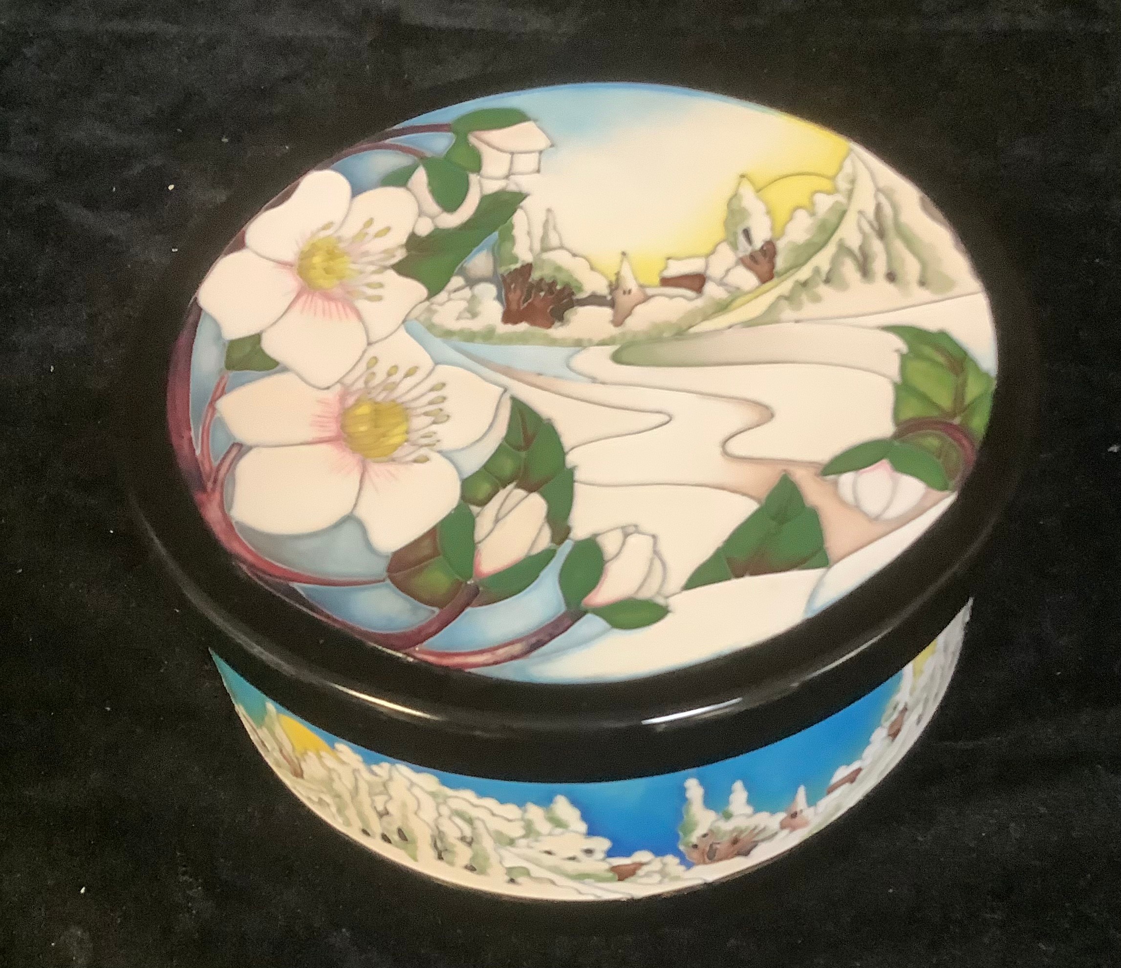 A Moorcroft circular bowl and cover, December Dawn pattern, tube lined with winter scene, designed