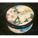 A Moorcroft circular bowl and cover, December Dawn pattern, tube lined with winter scene, designed