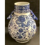 A Chinese twin handled blue and white ovoid vase, the handles as deer heads, decorated with