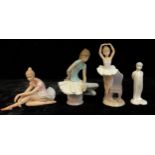 A Lladro model of a ballerina, two Leonardo ballerina figures; a Royal Doulton figure, The Kiss