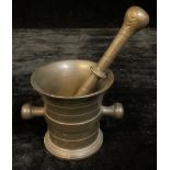 A bronze pestle and mortar