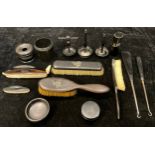 A collection of Edwardian ebony dressing table accoutrements, some silver mounted, qty