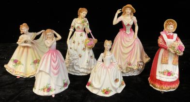 A Royal Doulton Royal Albert figure, Old Country Rose, Sweet Rose RA26; another, Old Country Rose