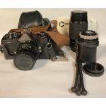 A Cosina CSM 35mm camera, Cosinon Auto MC lens, No.849345, with instruction booklet; a Prakticar