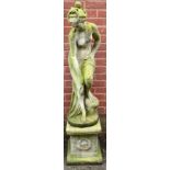 A reconstituted garden ornament of a lady, 145cm high 32cm wide.