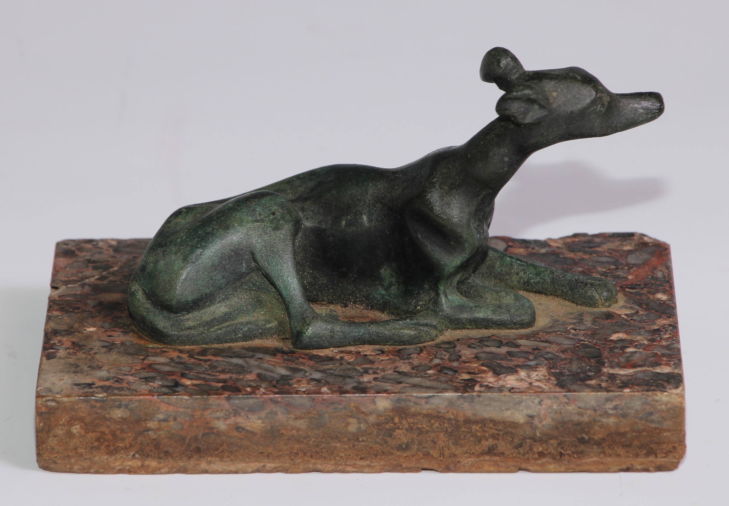 French School (19th century), a verdigris patinated bronze, of a recumbent greyhound, rectangular