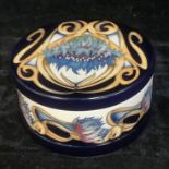 A Moorcroft circular bowl and cover, tube lined with cornflowers within ribbons of yellow,