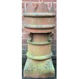 A terracotta castle top chimney pot, early 20th century, 77cm x 33cm