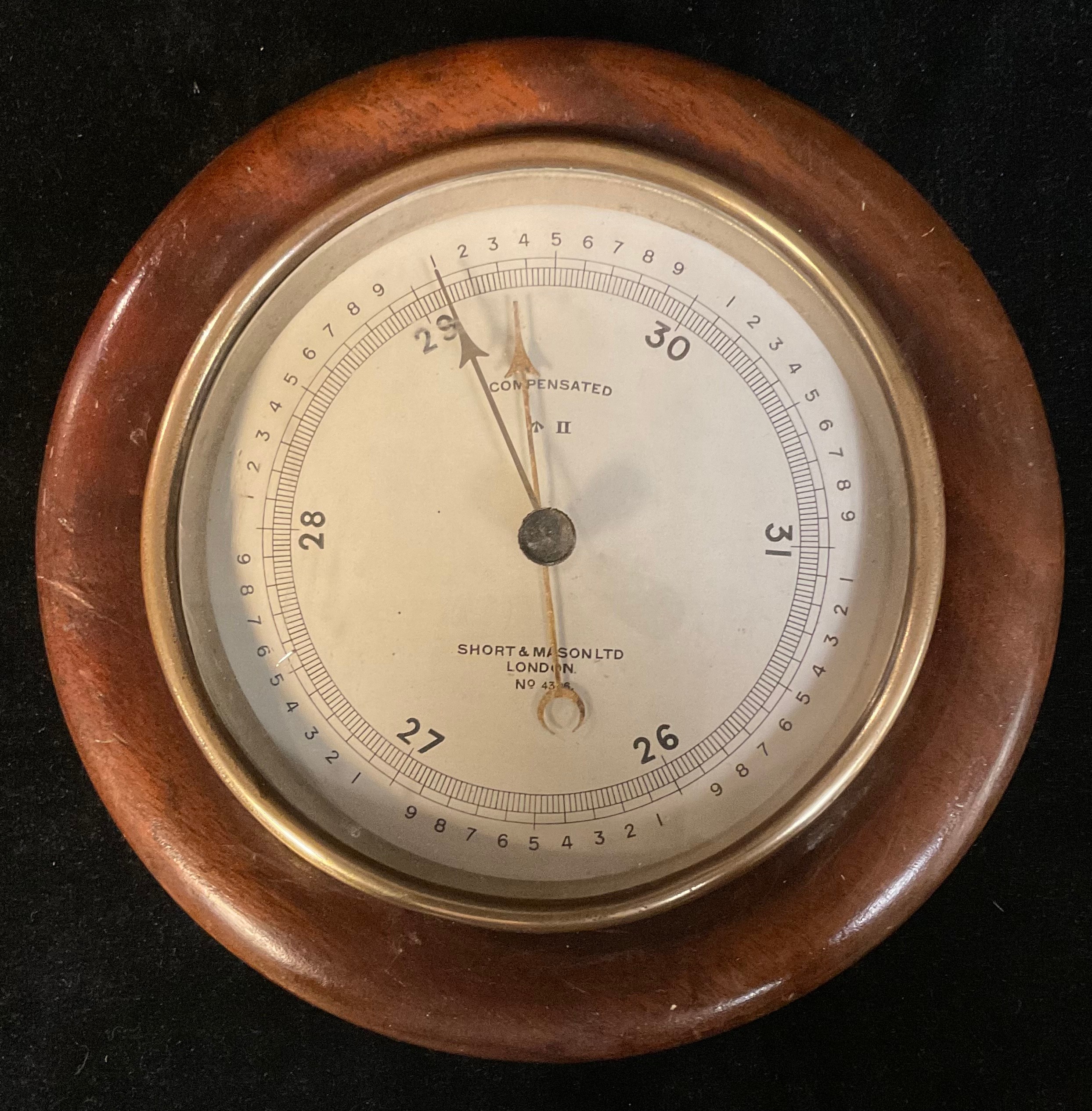 An early 20th century military issue aneroid barometer, silvered register inscribed Short & Mason