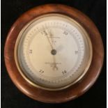 An early 20th century military issue aneroid barometer, silvered register inscribed Short & Mason