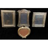 A silver rectangular photograph frame, 19cm x 17cm, London 1986; another, Victorian style, London