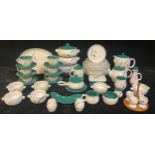 A Denby Greenwheat pattern part dinner and tea service comprising vegetable dishes, teapot, coffee