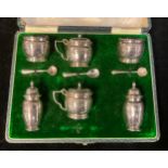 A George V silver six piece cruet set, comprising pair of salt, pair of pepper pots, pair of mustard