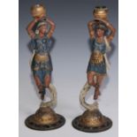 A pair of 19th century cold painted spelter figural candlesticks, cast as ethereal female figures