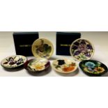 A Moorcroft circular dish, designed by Nicola Slaney, dated 2009, 6cm, boxed; others, tube lined