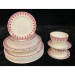 A Minton part dinner service transfer printed with a gothic trellis design after Pugin, in wine red,