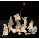 A Lladro figure, Bedtime; others, Dutch boy with milk pails, angels, polar bear, goose; a Spanish