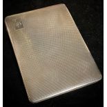 A silver rectangular engine turned cigarette case, Birmingham 1931, 183g gross