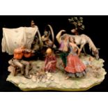 An Italian Capo-di-Monte/Naples figure group, Gypsy camp with wagon, musicians and dancers, 60cm