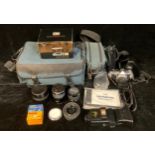 An Olympus OM1-N 35mm camera outfit, including Olympus OM-1N camera; Olympus OM auto-macro lens 90mm