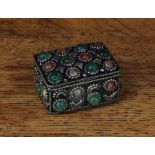 A silver coloured metal rounded rectangular box, set with agate and green stone cabochons, 4.5cm