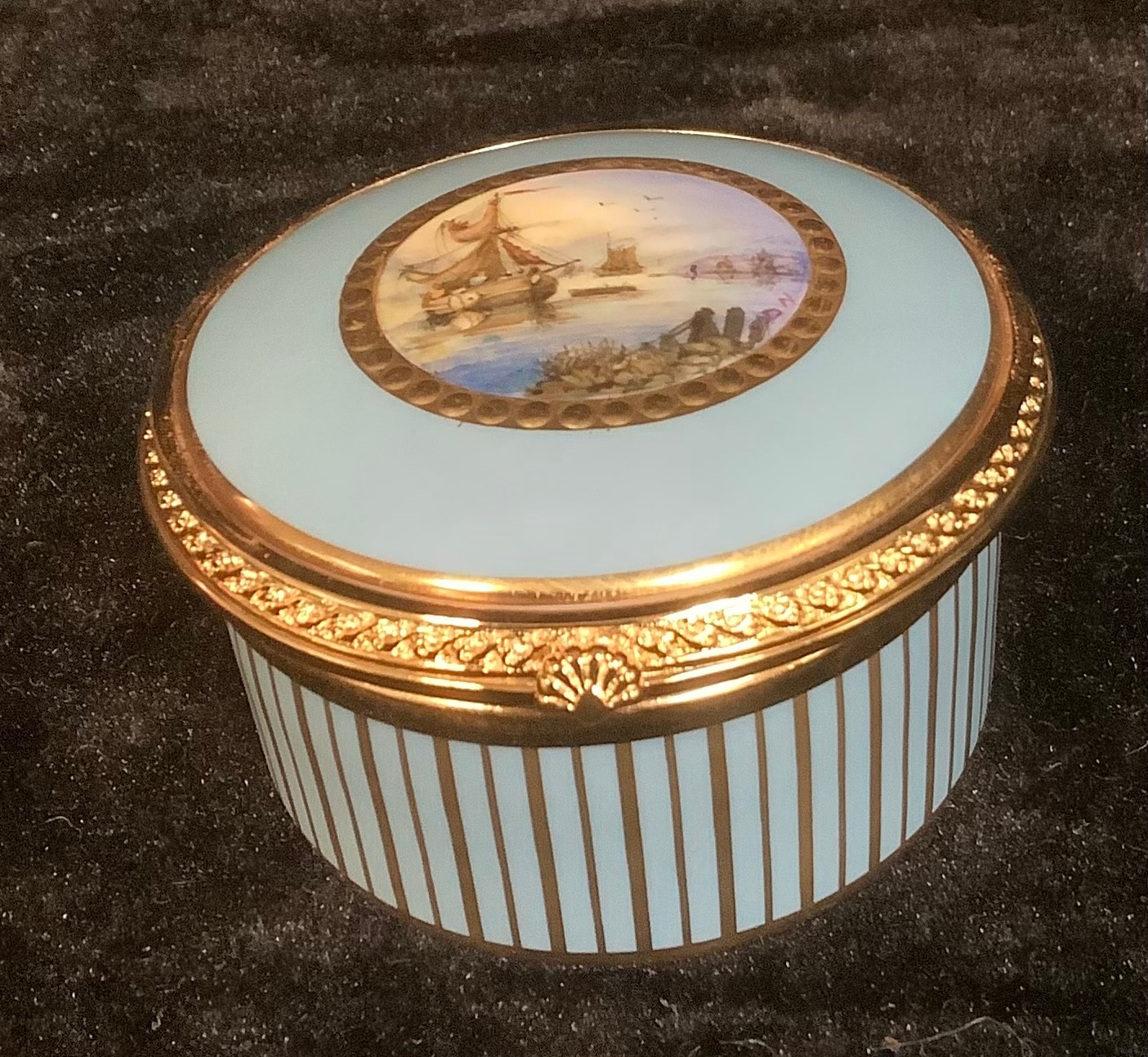 A Lynton porcelain circular table box, painted by Stefan Nowacki, signed, with schooners off the