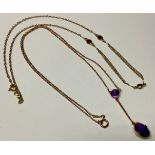 An Edwardian 9ct rose gold pendant droplet necklace, set with two faceted amethyst stones, 25cm