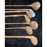 An early 20th century golf club, hickory shaft; others similar, putter, steel shaft, etc; Tom