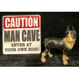 A cast iron Boston Bulldog, 20.35cm high; a square cast iron sign, CAUTION, MAN CAVE, ENTER AT