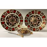 A pair of Royal Crown Derby Imari palette 1128 pattern dinner plates, seconds; an 1128 patern teacup